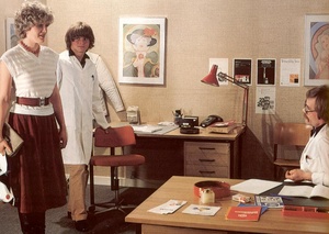 Two seventies doctors inspecting a dripp - Picture 3
