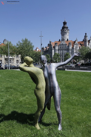 Two green and grey zentai wearing flexib - Picture 1