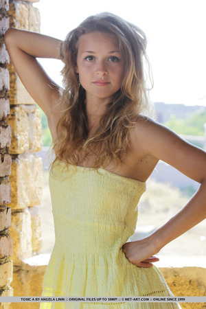 Tasty young chick in yellow dress strips - Picture 2