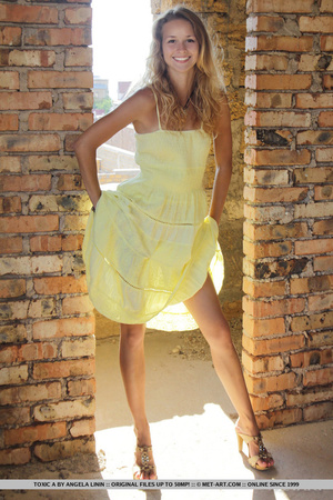 Tasty young chick in yellow dress strips - Picture 3