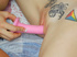 Hot tattooed chick lie nude on bed as sexy friend uses pink dildo to drill