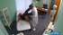 Lustful doctor in glasses stretches his brunette patient's cut with his