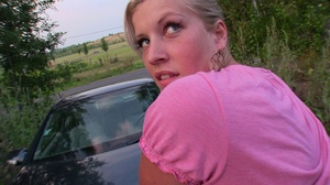 Beautiful blonde teen bending over a car - Picture 6