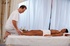 Gorgeous black haired girl receives a sensual oil massage.