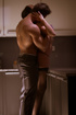 Elegant brunette loves the way he is fucking her on the kitchen.