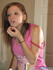 Pretty in pink hottie Riley Rebel fixing her hair and make up