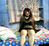 Lustful Indian slut in a mask and a black gown riding dick to calm down