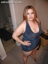 Big fat milf Amora seductively posing on the bed and showing all she got.