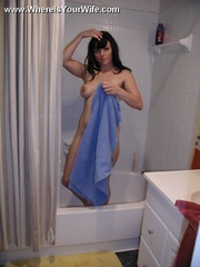 Pretty dark haired wife with perfect boobs taking off her leather boots and red panties before shower.