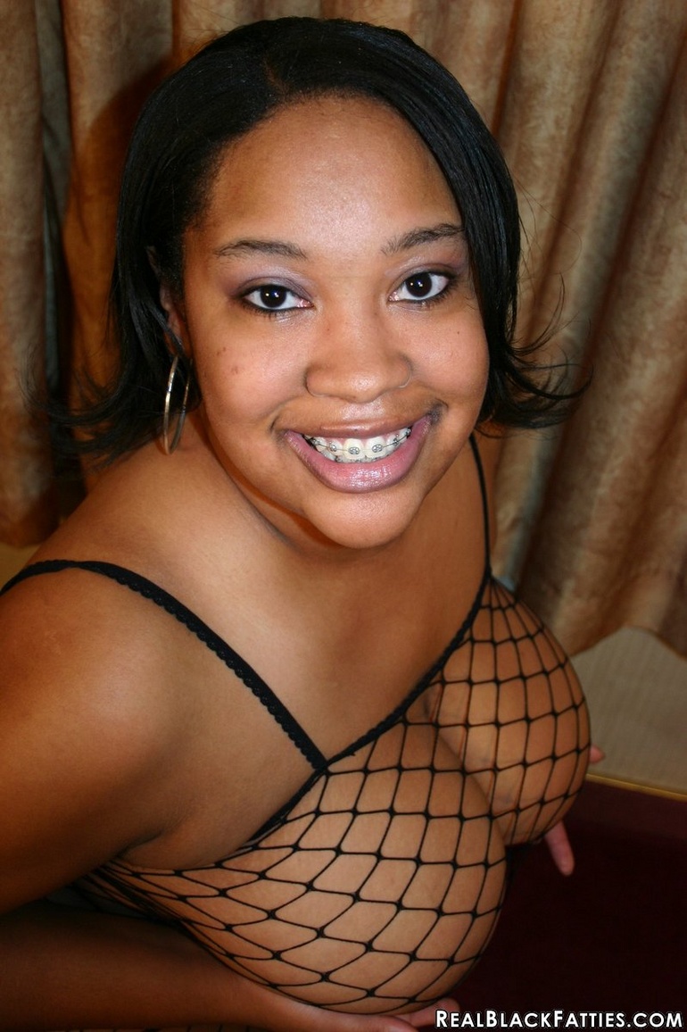 Those big brown boobs blossom out of her fishnet - Picture 6