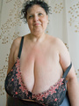 Curly brunette mature demonstrates her - Picture 8
