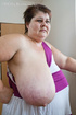 Old fat slut with gigantomastia gets naked