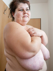 Old fat slut with gigantomastia gets naked - Picture 14