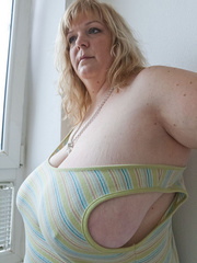 Slutty blonde bbw teasing you with her milky titties - Picture 8