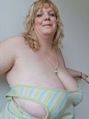 Slutty blonde bbw teasing you with her milky titties - Picture 9
