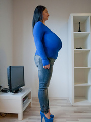 Brunette babe with huge juggs in jeans and blue pullover - Picture 6