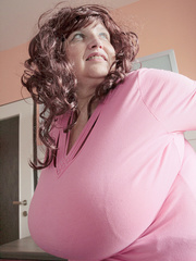 Curly brunette bbw in a pink pullover boasting with her - Picture 6