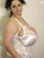 Big-titted chick in a lace body teasing - Picture 1