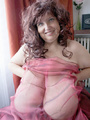 Curly brunette mature wrapped into pink - Picture 6