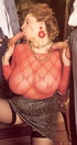 Red mature with mega tits in a transparent red blouse sucks two cocks