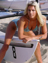Randy blonde beach babe exposing her magnificent body at the beach.
