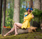 Colorful cute elegant sex model drops some clothes to show supple curves