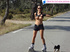 Ponytailed brunette roller skater with a dog topless