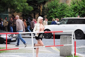 Blonde hot beauty exposing her stunning boobs in public. - Picture 1