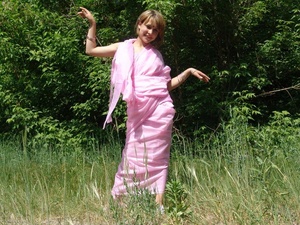 Blonde teeny unwrap a pink sari to pose nude in the forest - Picture 1