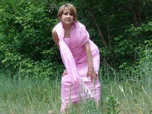 Blonde teeny unwrap a pink sari to pose nude in the forest - Picture 10
