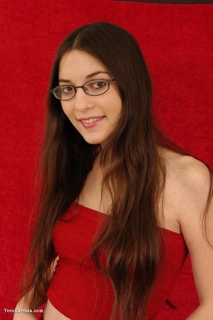 Cute brunette teen babe in glasses exposing her slim body - Picture 2