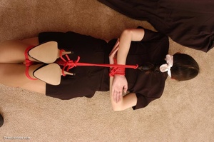 Ponytailed brunette teen gagged and roped tightly - Picture 3