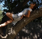 Lovely teeny with fair hair undresses to climb a tree
