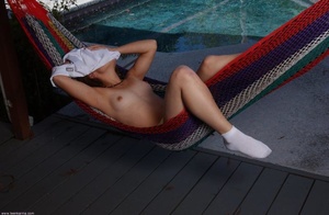 Lovely brunette freshie undresses to pose naked in white socks - Picture 7