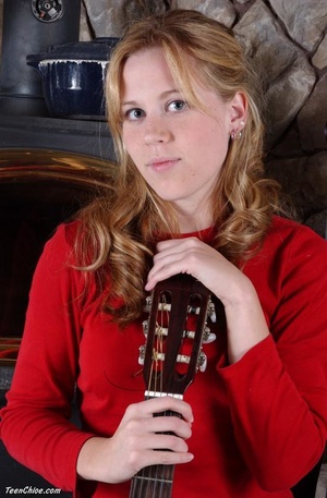 Cute blonde teeny undresses to pose with a guitar - Picture 3