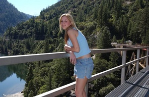 Dirty blonde teen bitch gets nude to pose on the railroad bridge - Picture 1