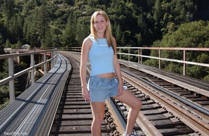 Dirty blonde teen bitch gets nude to pose on the railroad bridge - Picture 2