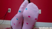 This cute sexy and slutty blackhaired teen teasing with her hot little pink socks and cute feets