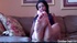 Latina in blue top shows off her red painted toenails