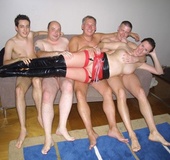 Ponytailed brunette mom in stockings and high boots rocking with four