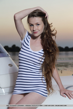 Adorable teen enjoys boat rides at night - Picture 1