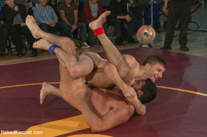 People watch as four hot studs wrestle a - Picture 1