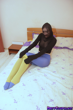 Teen babe in various tights on legs and with a stocking on her head - Picture 6