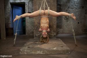 Cute girl bound and hung upside down wit - Picture 1