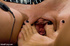 Girl strapped in black made to suck feet gets caned and fucked with feet