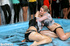 Crowd gets crazy when watching a fighting of two chick in the pool with