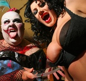 Fat bald clown in dress and hot chick going wild and crazy out on the