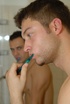 Hot stud saw a handsome dude brushing his teeth with him in the men's