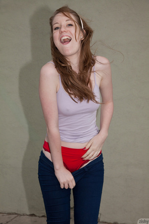 Slim teen redhead in sexy skinny jeans o - Picture 3