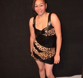 Seductive exotic housewife posing in a sexy dress and high heels trying